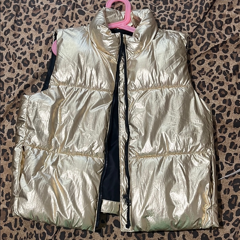 Shiny Gold puffer. No tags but never worn. Perfect condition.
